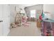 Bright bedroom with a playhouse-style bed, toys, and decor creating a cheerful and imaginative space at 132 Moores Branch Rd, Mount Holly, NC 28120