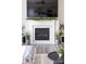 Elegant marble fireplace with a decorative mantel, perfect for creating a cozy and inviting atmosphere at 132 Moores Branch Rd, Mount Holly, NC 28120