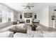 Spacious living room with fireplace, fan, shiplap accent wall, neutral furniture, and plenty of seating at 132 Moores Branch Rd, Mount Holly, NC 28120