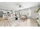 Bright living room features an open concept design with large sectional sofa and neutral tones at 132 Moores Branch Rd, Mount Holly, NC 28120
