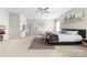 Spacious main bedroom with a ceiling fan, walk-in closet, and neutral color scheme at 132 Moores Branch Rd, Mount Holly, NC 28120