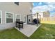 Cozy backyard patio featuring a grill, pergola, and seating for outdoor dining and relaxation at 132 Moores Branch Rd, Mount Holly, NC 28120