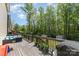 Expansive back deck with seating, grill, planters, overlooking a lush, green backyard and storage shed at 1336 26Th Ne Ave, Hickory, NC 28601