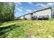Fenced backyard offers a secure space with lawn, privacy, and back of neighboring homes at 1336 26Th Ne Ave, Hickory, NC 28601