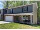 Charming two-story home with stone accents, a welcoming front porch, and a well-manicured lawn at 1336 26Th Ne Ave, Hickory, NC 28601
