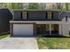 Charming two-story home with stone accents, a welcoming front porch, and a well-manicured lawn at 1336 26Th Ne Ave, Hickory, NC 28601
