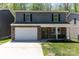 Charming two-story home with stone accents, a welcoming front porch, and a well-manicured lawn at 1336 26Th Ne Ave, Hickory, NC 28601