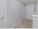 Upstairs hallway area with neutral carpeting, white doors and trim, and a thermostat at 1336 26Th Ne Ave, Hickory, NC 28601