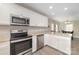 Bright kitchen featuring white cabinets, stainless steel appliances, granite countertops, and hardwood floors at 1336 26Th Ne Ave, Hickory, NC 28601