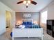 Bright bedroom with a ceiling fan, natural light, and ample closet space at 1421 Lyon Ct, Charlotte, NC 28205