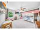 Bright bedroom featuring a bunk bed, large windows, and a playful atmosphere with a unicorn plush at 1421 Lyon Ct, Charlotte, NC 28205