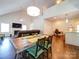 Open-concept dining area featuring hardwood floors and abundant natural light at 1421 Lyon Ct, Charlotte, NC 28205