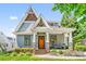 Charming home featuring a peaked roof, craftsman pillars, and a welcoming front porch at 1421 Lyon Ct, Charlotte, NC 28205