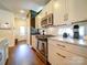 Modern kitchen features stainless steel appliances, granite countertops, and sleek white cabinets at 1421 Lyon Ct, Charlotte, NC 28205