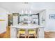 Bright kitchen featuring white cabinets, granite countertops, pendant lighting, and stainless steel appliances at 1421 Lyon Ct, Charlotte, NC 28205
