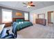 Serene main bedroom with coffered ceilings, wood furniture, and large windows for natural light at 1421 Lyon Ct, Charlotte, NC 28205