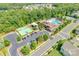 Aerial view of community clubhouse and pool with playground and basketball court at 1446 Cilantro Ct, Tega Cay, SC 29708