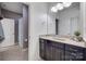 Bathroom featuring granite countertop, double sinks, and gray walls at 1446 Cilantro Ct, Fort Mill, SC 29708