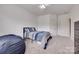 Neutral bedroom featuring a ceiling fan and carpeted floor at 1446 Cilantro Ct, Tega Cay, SC 29708