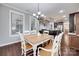 Bright dining room featuring hardwood floors and natural light at 1446 Cilantro Ct, Tega Cay, SC 29708