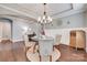 Stylish dining area featuring a modern chandelier, round table, and decorative wall accents at 1446 Cilantro Ct, Fort Mill, SC 29708