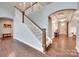 Spacious foyer with hardwood floors and staircase leading to the second floor at 1446 Cilantro Ct, Tega Cay, SC 29708