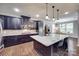 Spacious kitchen with a large island, stainless steel appliances, and an adjacent dining area at 1446 Cilantro Ct, Tega Cay, SC 29708