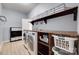 Bright laundry room with washer, dryer, built-in shelving, and ample counter space at 1446 Cilantro Ct, Tega Cay, SC 29708