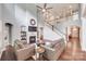 Inviting living room with high ceilings, a fireplace, and ample seating at 1446 Cilantro Ct, Fort Mill, SC 29708