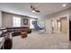Finished basement with a plush sectional sofa, an air hockey table, and basketball game at 1446 Cilantro Ct, Tega Cay, SC 29708