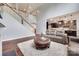 Inviting living room with an open staircase, and view into the kitchen at 1446 Cilantro Ct, Tega Cay, SC 29708