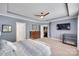 Large primary bedroom featuring tray ceilings, neutral carpet, and an open doorway at 1446 Cilantro Ct, Tega Cay, SC 29708