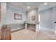 Home office space featuring L-shaped desk and neutral walls at 1446 Cilantro Ct, Tega Cay, SC 29708