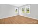 Bright bedroom with hardwood flooring and natural light from multiple windows at 145 Burton Hills Cir, Gastonia, NC 28054