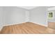 Clean bedroom featuring hardwood flooring and ample natural light at 145 Burton Hills Cir, Gastonia, NC 28054