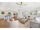 Bright, open-concept living space with hardwood floors, modern furnishings, and a view into the stylish kitchen at 145 Burton Hills Cir, Gastonia, NC 28054
