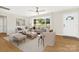 Inviting living room featuring neutral tones, modern furniture, hardwood floors, and a bright, open window at 145 Burton Hills Cir, Gastonia, NC 28054