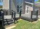 Back deck leads to a grassy yard with privacy fence, offering a seamless indoor-outdoor transition at 15326 Carrington Ridge Dr, Huntersville, NC 28078