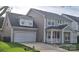 Charming two-story home featuring a two-car garage, inviting front porch, and well-maintained landscaping at 15326 Carrington Ridge Dr, Huntersville, NC 28078
