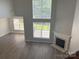 Bright living room features hardwood floors, a fireplace, and lots of natural light at 15326 Carrington Ridge Dr, Huntersville, NC 28078