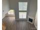 Bright living room features hardwood floors, a fireplace, and lots of natural light at 15326 Carrington Ridge Dr, Huntersville, NC 28078