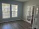 Bright home office featuring new floors, large window with blinds, and stylish french doors at 15326 Carrington Ridge Dr, Huntersville, NC 28078