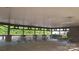 Spacious picnic pavilion featuring numerous picnic tables, ceiling fans, and access to outdoor green spaces at 15326 Carrington Ridge Dr, Huntersville, NC 28078
