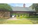 Community picnic pavilion with stone accents, picnic tables, flower beds, and manicured shrubs at 15326 Carrington Ridge Dr, Huntersville, NC 28078