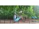 Large playground with climbing structure, slides, swing set and picnic table in a fenced in, mulched play area at 15326 Carrington Ridge Dr, Huntersville, NC 28078