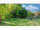 Large backyard with mature trees and a play area at 1618 33Rd Ne Ave # 1, Hickory, NC 28601