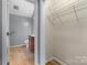 Bathroom and walk-in closet featuring a sink, toilet, and wire shelving at 1618 33Rd Ne Ave # 1, Hickory, NC 28601
