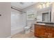 Bathroom with tub-shower combination, oak vanity, and tile floors at 1618 33Rd Ne Ave # 1, Hickory, NC 28601