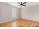 Bright bedroom features hardwood floors, ceiling fan, and a large window at 1618 33Rd Ne Ave # 1, Hickory, NC 28601