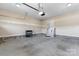 Clean garage with overhead lighting and side door at 1618 33Rd Ne Ave # 1, Hickory, NC 28601